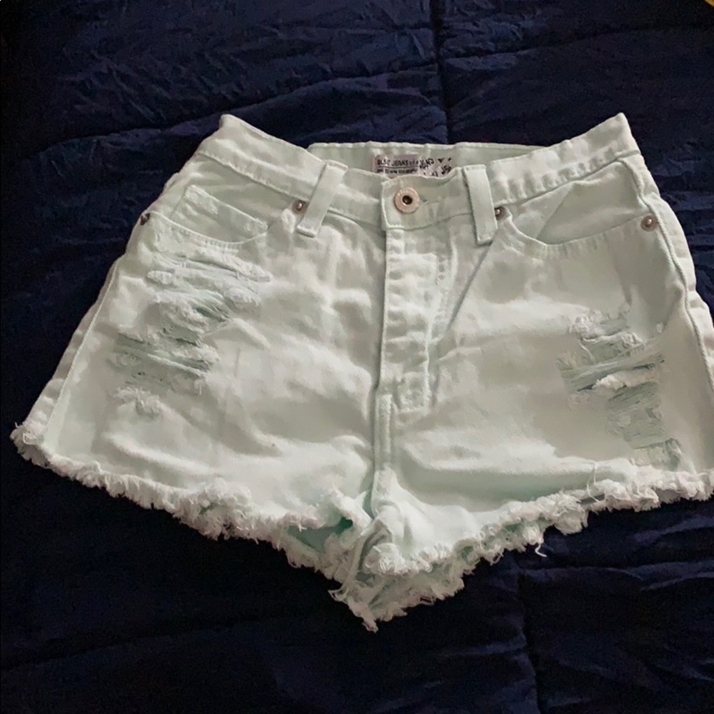 Distressed light blue shortie jean shorts